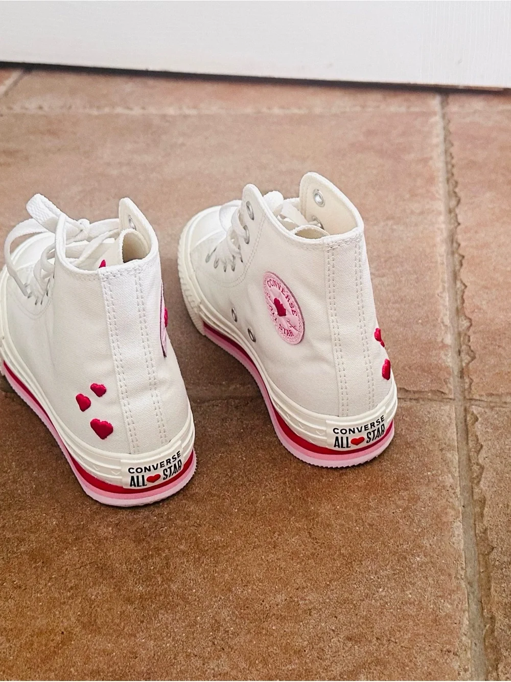 Converse White High-Top Sneakers with Pink Accents
